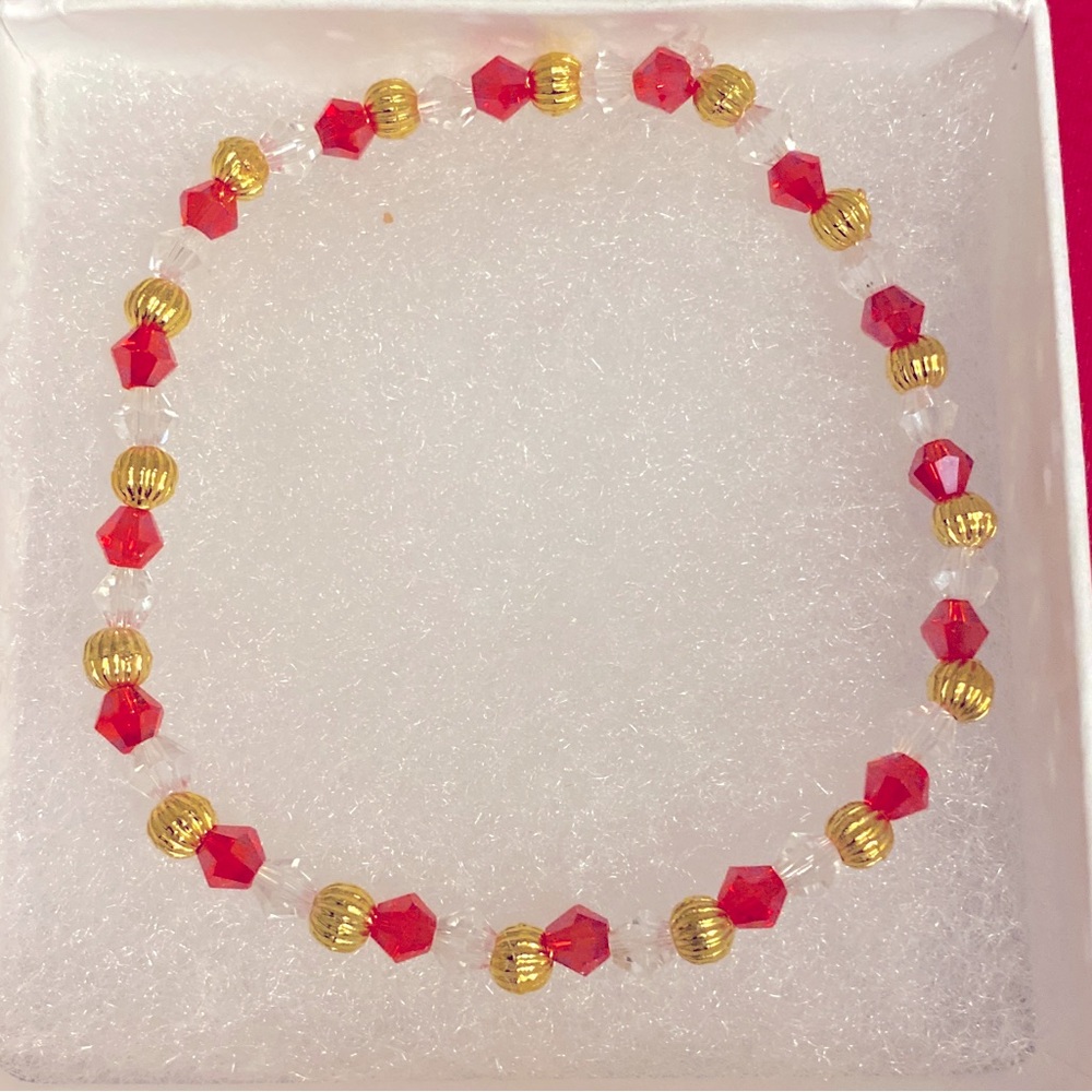 Ruby red and gold, clear beaded stretchable bracelet